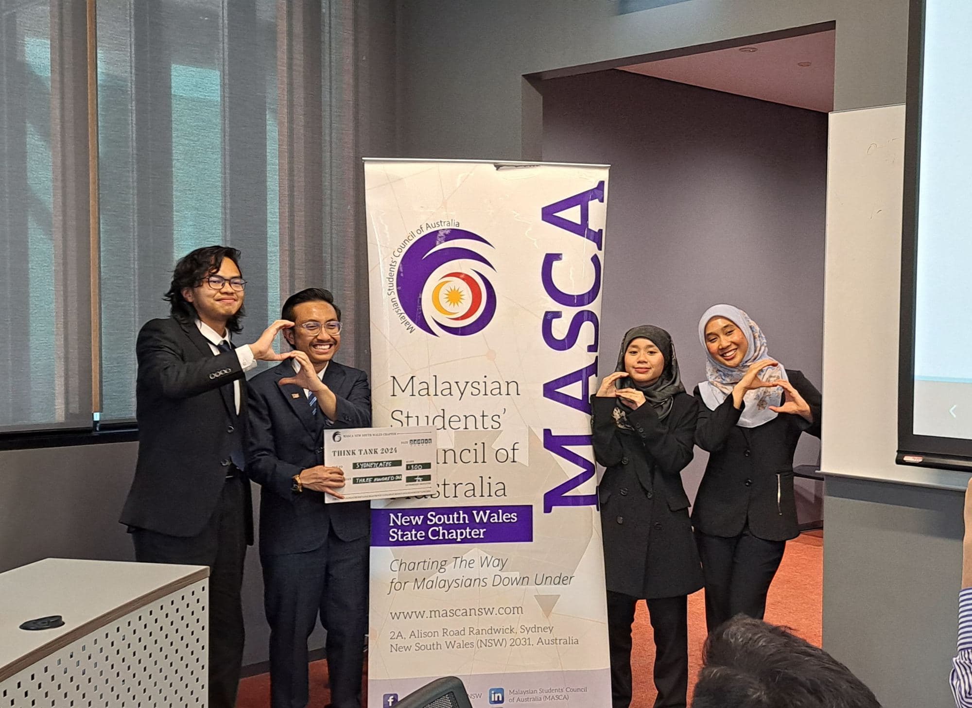 Think Tank participants with their award at the MASCA NSW banner